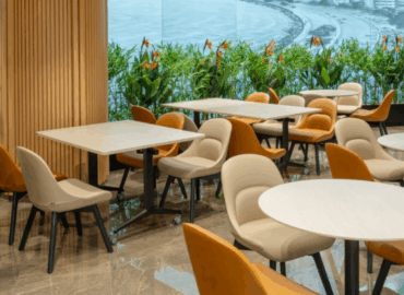 Modern office furniture showroom with various desks and chairs