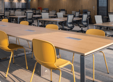 Professional business people discussing around a stylish boardroom table