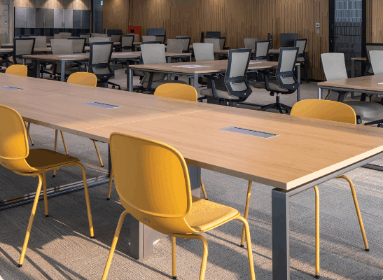 Office workers collaborating behind a movable office wall